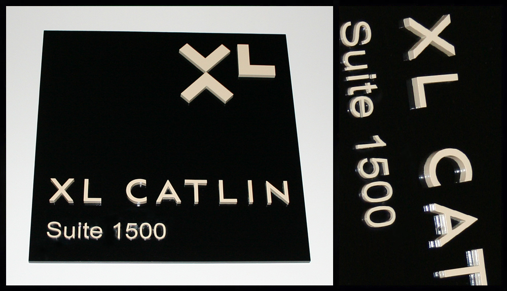 Laser die-cut letters (letters custom painted, any color) and then bonded to a die-cut black Plexi base. 